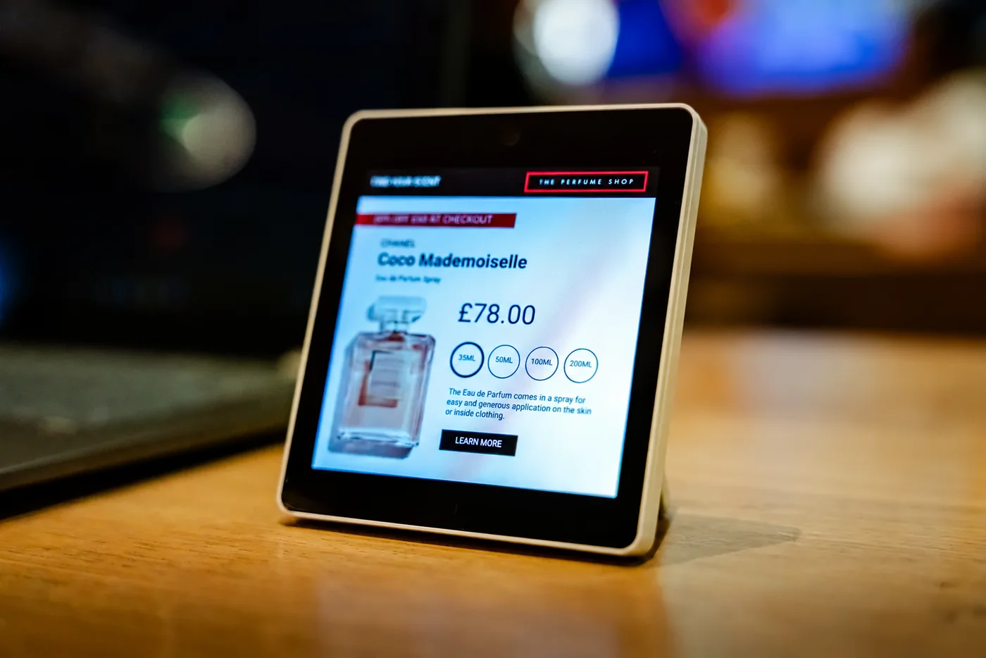 A retail tablet displaying product details and pricing